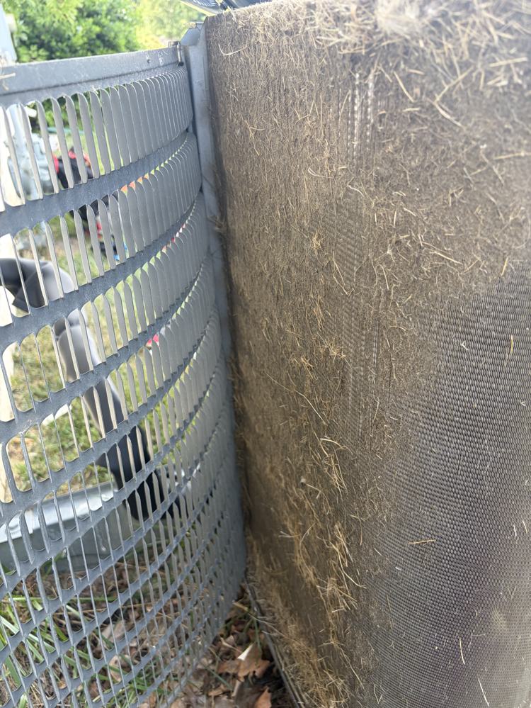 Condenser coil matted with debris before cleaning